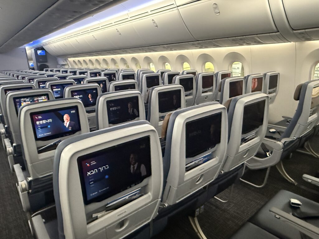 American Airlines' economy class cabin aboard the 787-9, as seen from the back of the cabin, with seatback IFE in each seat.