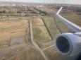 WestJet 737 engine and wing as seen out the window.