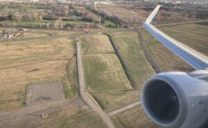 WestJet 737 engine and wing as seen out the window.