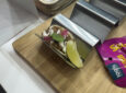 Plant-based pulled pork-style tacos on display for guests to try at AIX 2025