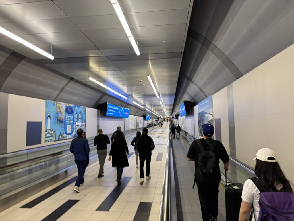 People walking through the tunnel.