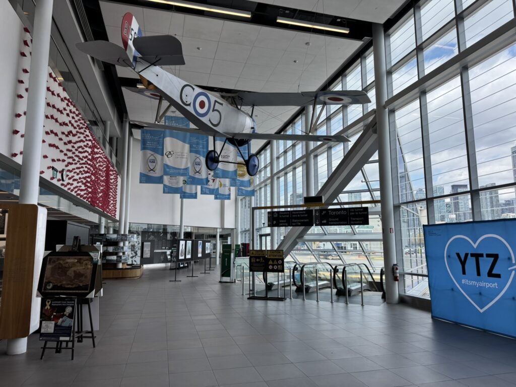 A bi-plane hangs in Billy Bishop Airport terminal