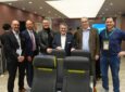 Executives of Luxair and Recaro in front of the R2 seat