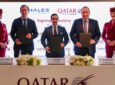 Thales and Qatar Airways executives stand for a photo together at the signing.