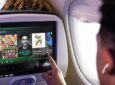 Spotify is shown on the Untied Airlines A321neo seatback IFE screen being used by a passenger.