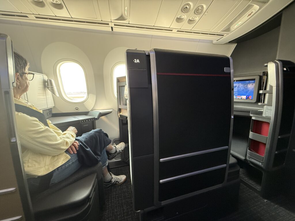 High walled seat with an open privacy door