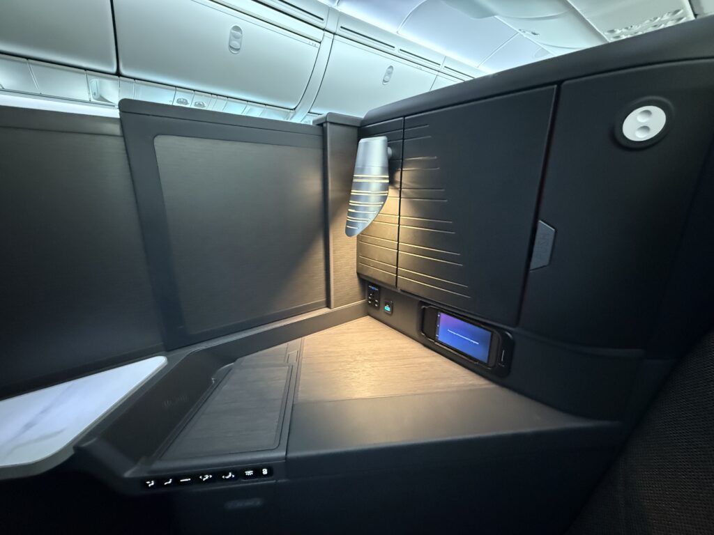 Inside a closed suite with dark furniture. 
