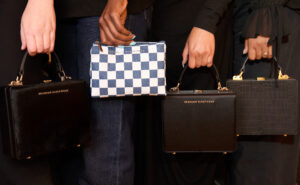 American Airlines amenity kit satchels, used as bags by four people. They are designed by Brandon Blackwood
