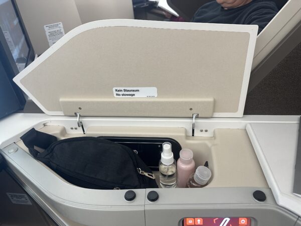 Personal contents are placed in one of the seat's multiple storage compartments.