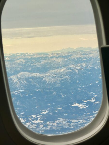 The Alps as seen through a cabin window on this Austrian 787