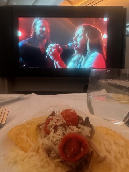 Dinner and a movie in the business class seat