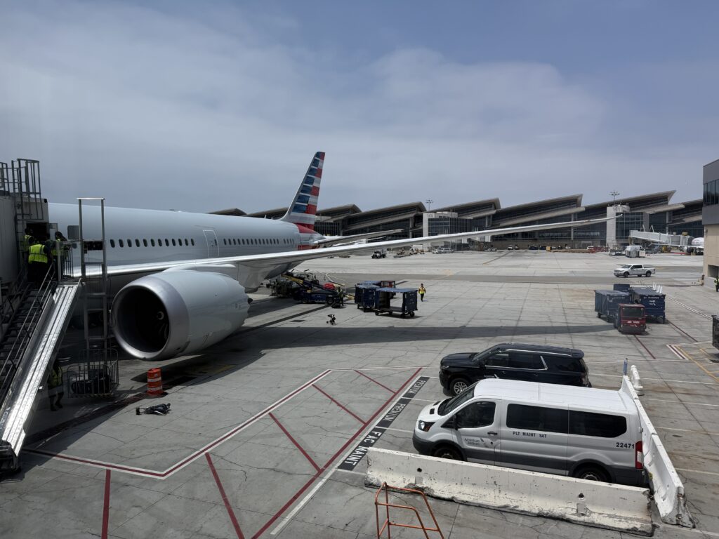 Boeing 787-9P parked at the gate.