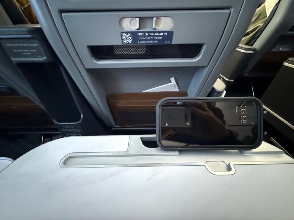 Device leans against the device holder. 