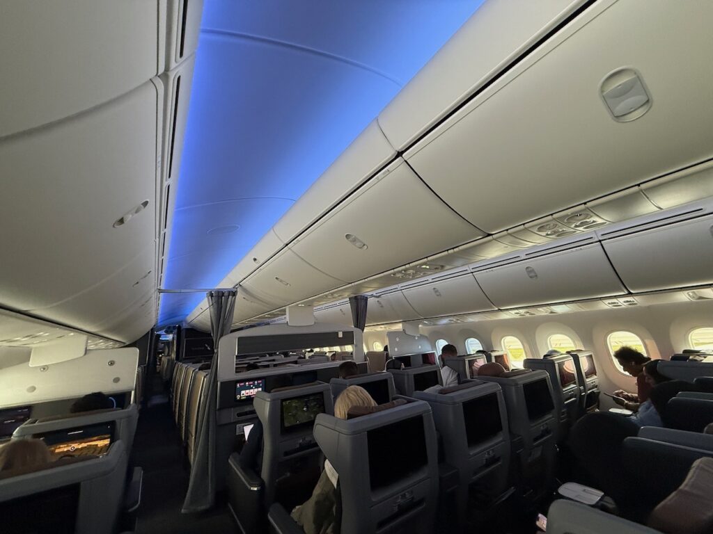 Blue LED lighting down the length of the 2-3-2-configured PE cabin.