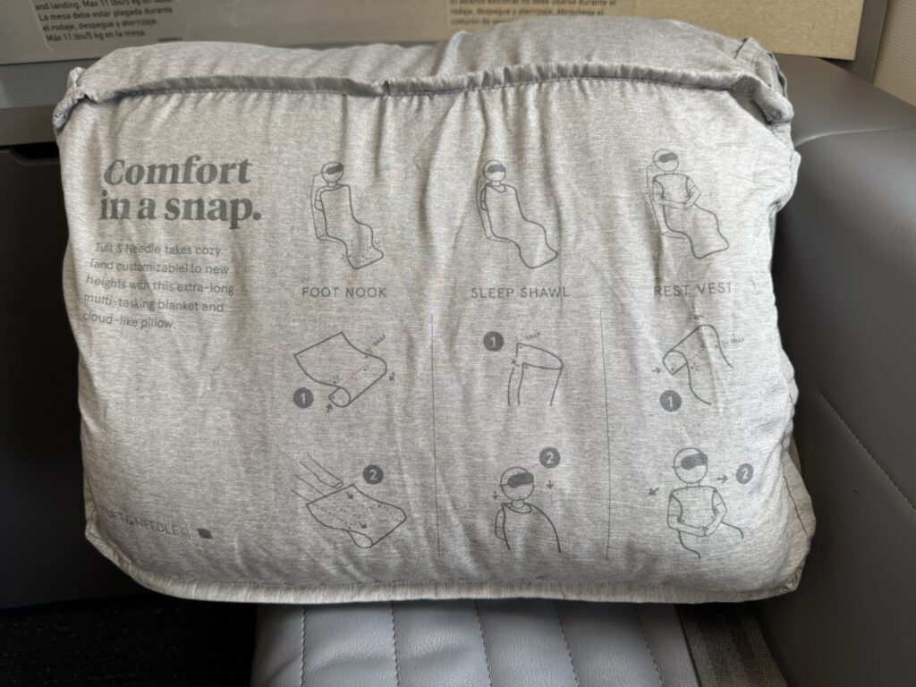 A blanket with instructions on how to use it printed on its packaging. 