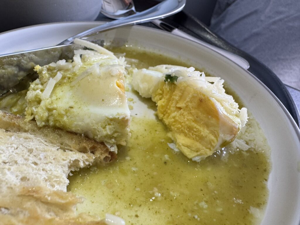 Partially eaten egg breakfast on a plate