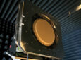 The multi-band, multi-beam, multi-orbit ESA from Kymeta is hanging in a protected chamber. It is a large red circle.