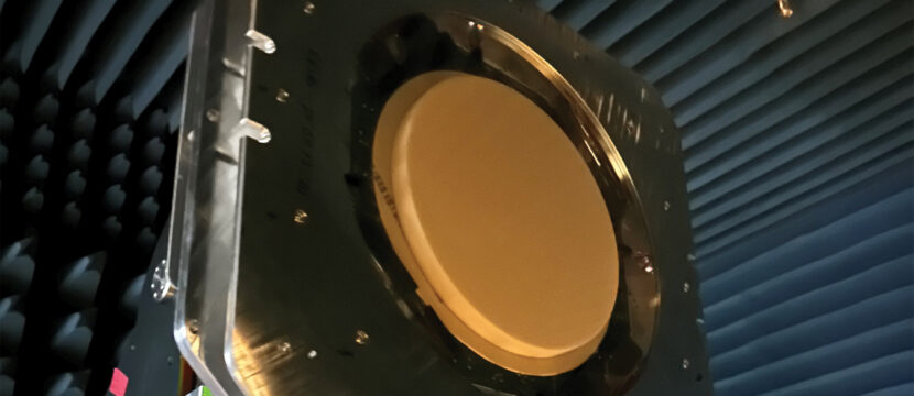 The multi-band, multi-beam, multi-orbit ESA from Kymeta is hanging in a protected chamber. It is a large red circle.