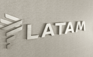 LATAM branding in silver on a monument