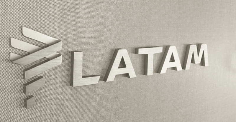 LATAM branding in silver on a monument
