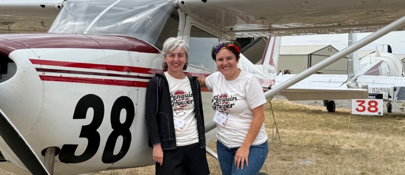 Team 38 - Penguin Power -Elizabeth Menozzi Sammy-Rai Brain at the end of the race, posing for a photo in front of their aircraft.