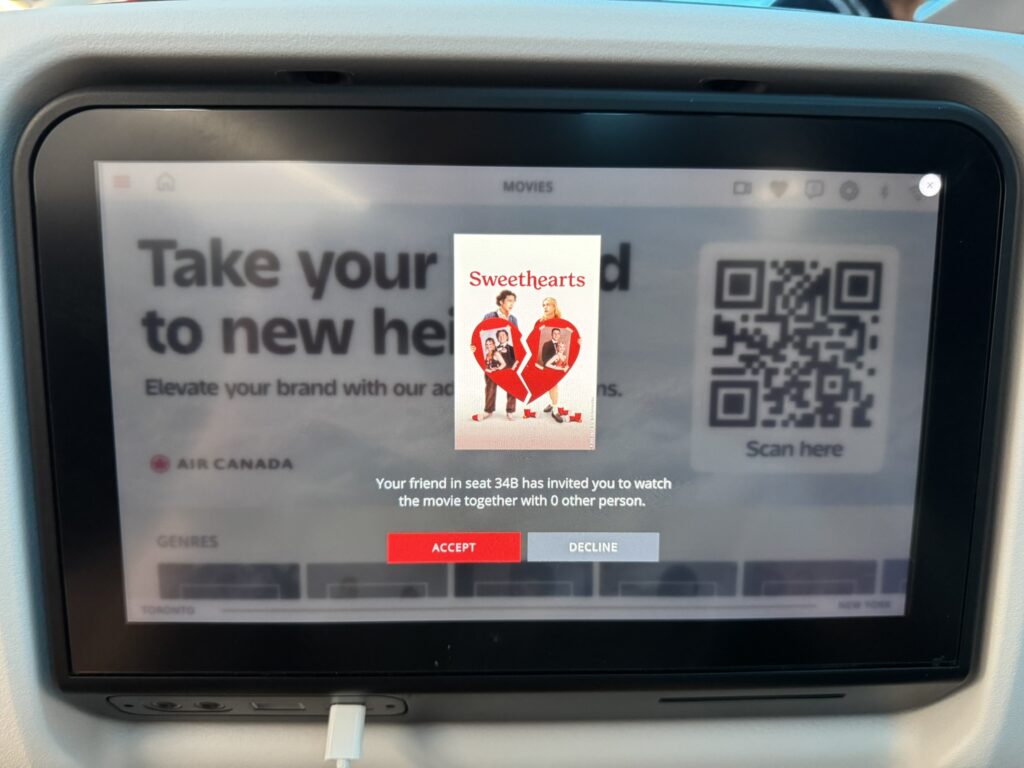The IFE is attempting to share the movie with a fellow passenger. 