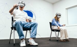Two people are using VR headsets as part of their A320 type rating training.