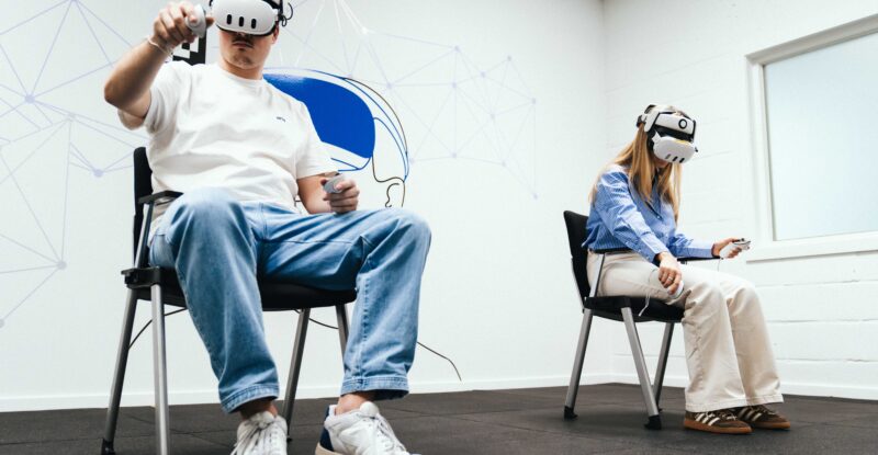Two people are using VR headsets as part of their A320 type rating training.
