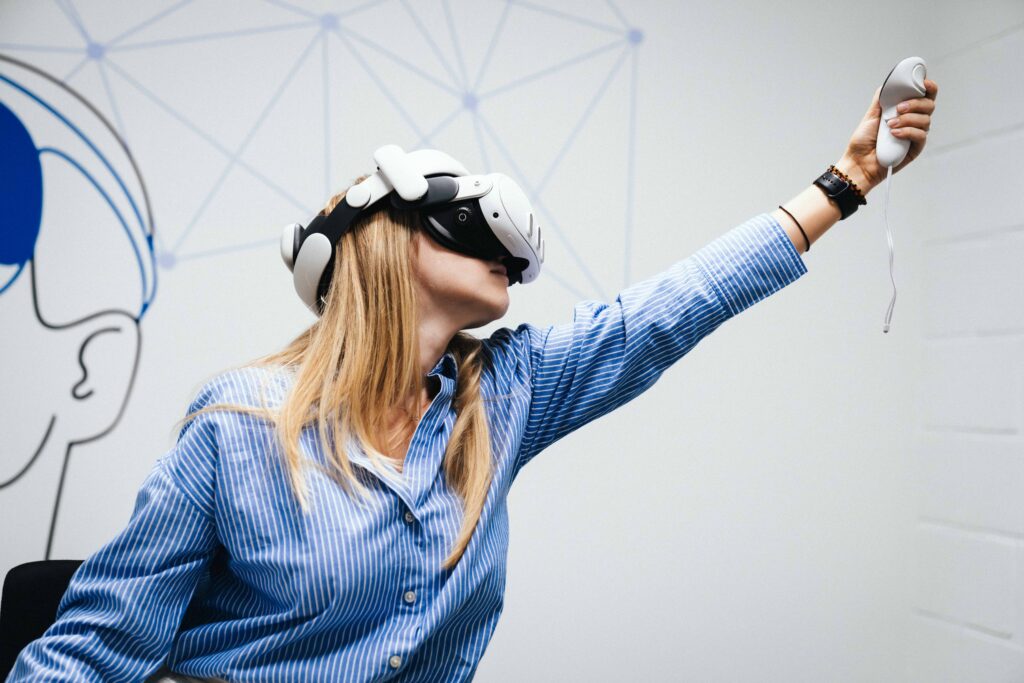A woman is using a VR headset as part of her A320 type rating training.