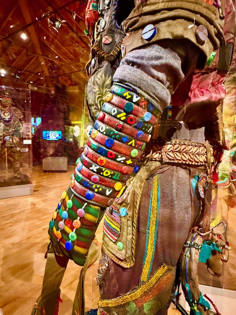 A close up of the detailed beading on the costume.