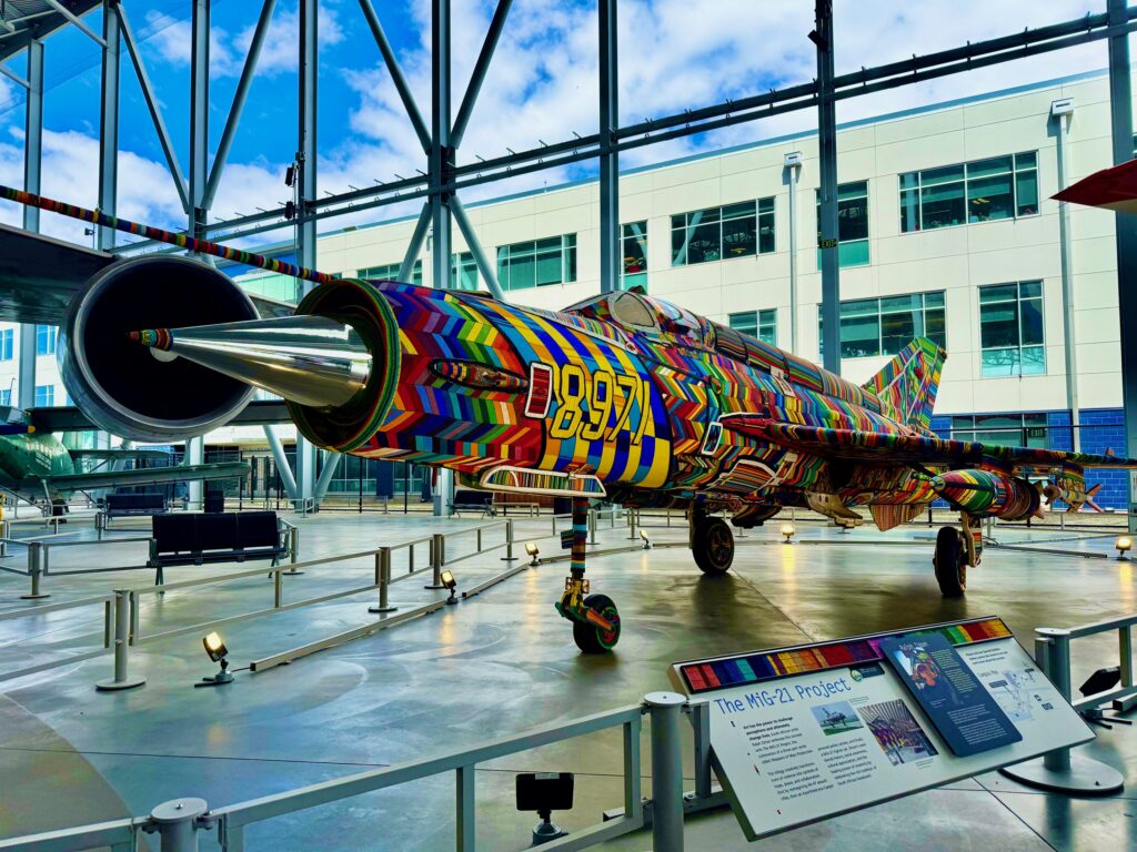 The MiG-21 jet is covered with colorful beads, as seen at the museum.