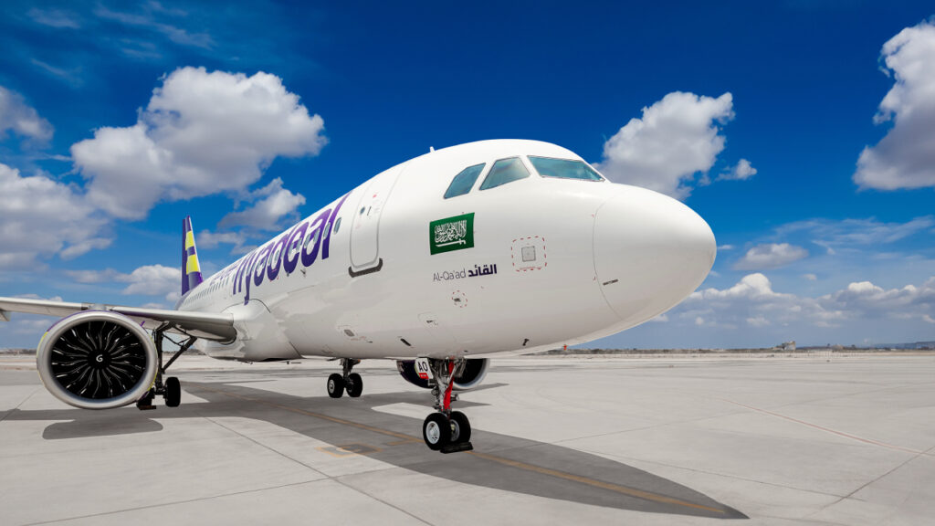 flyadeal A320neo parked on a sunny day