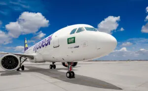 flyadeal A320neo parked on a sunny day