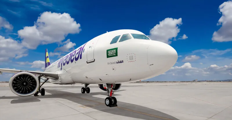 flyadeal A320neo parked on a sunny day