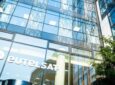 Eutelsat headquarters. The office features tall windows and Eutelsat's name in white letters.