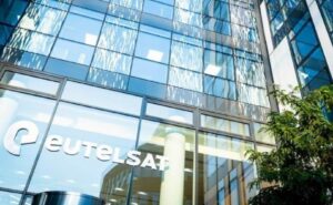 Eutelsat headquarters. The office features tall windows and Eutelsat's name in white letters.