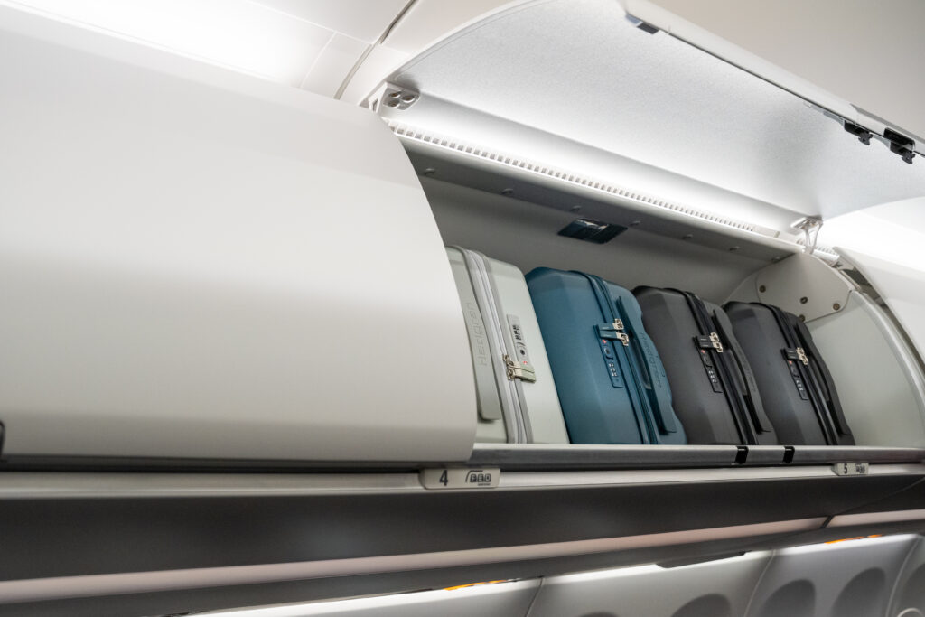 Brussels Airlines A320neo overhead compartments are filled with luggage.
