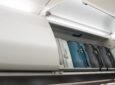 Brussels Airlines A320neo overhead compartments are lined with luggage.