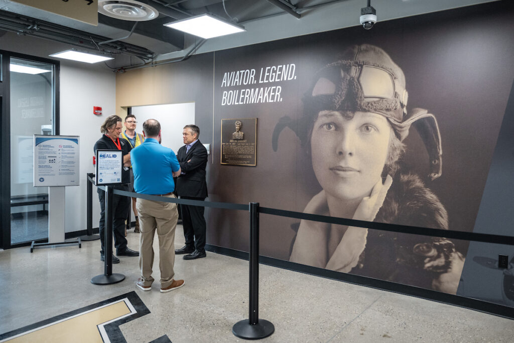 A large image of Amelia Earhart on the wall at the boarding gate in the new terminal