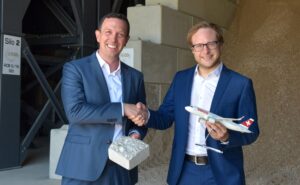 SWISS and neustark executives shake hands