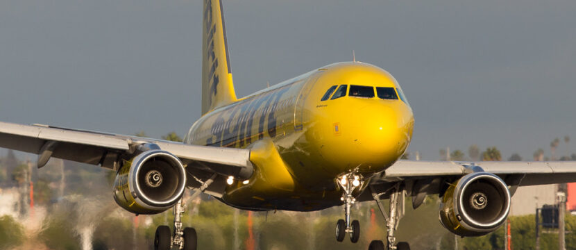 Spirit Airlines A320, in the carrier's signature yellow and black livery, on landing.