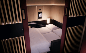 SWIAA A350 Senses first class suite with a double bed laid out.