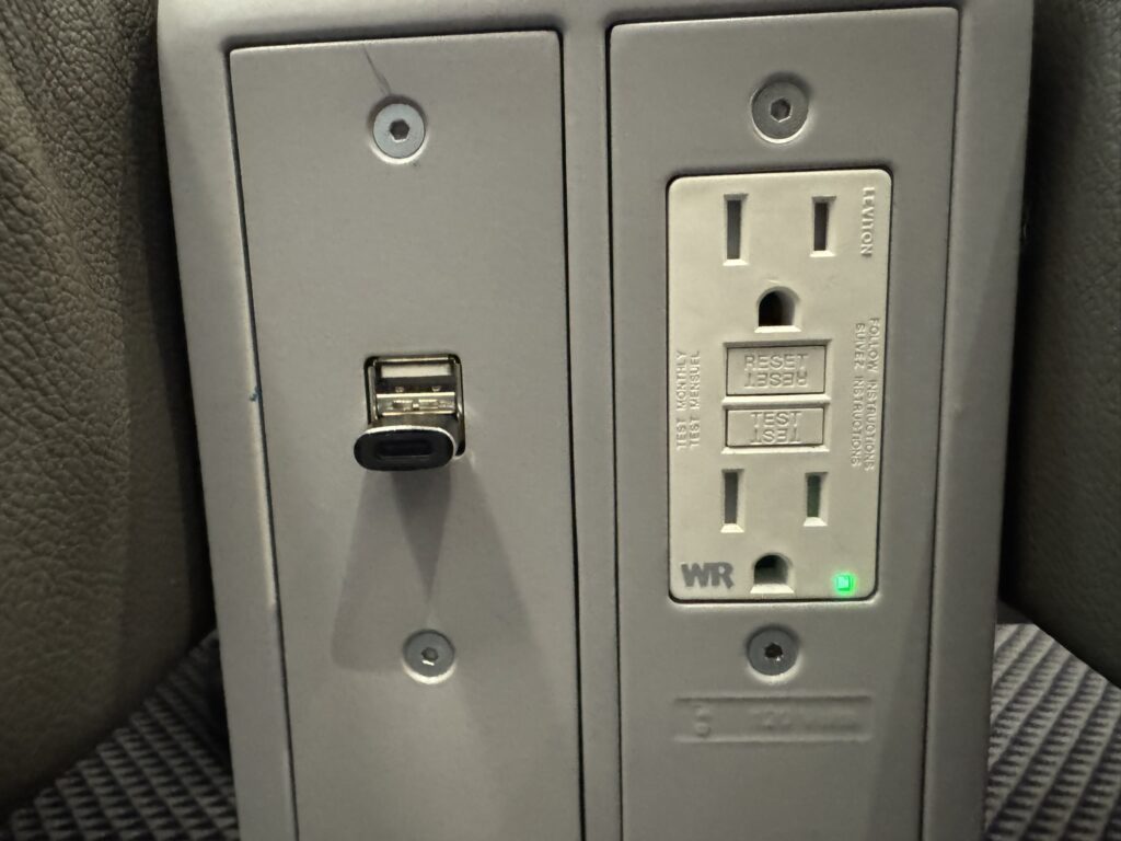 Various forms of charging for devices available on the Acela train. 