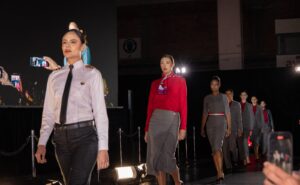 Avianca uniforms on models who are walking on the runway