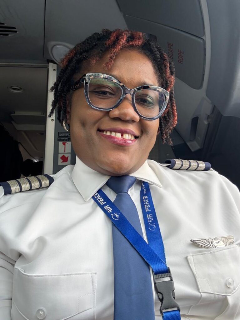 Captain Ibironke Rotimi-Olajide in the cockpit of the E195 E2