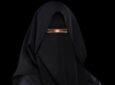 Captain Qadar Sarfraz in a black niqab on a black background