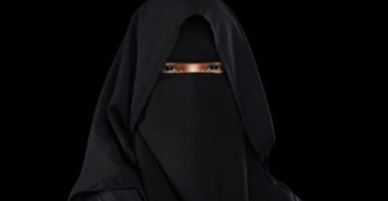 Captain Qadar Sarfraz in a black niqab on a black background