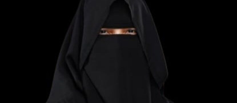 Captain Qadar Sarfraz in a black niqab on a black background