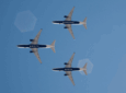 Three Delta aircraft in flight and each belly has the name of a destination on it, Sardinia. Malta, Ibiza.