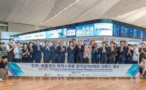 Korean and Delta execs celebrate remote baggage screening pact